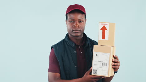 African-courier-man,-boxes-and-studio-with-face