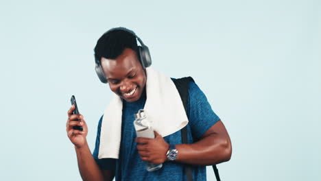 Black-man,-fitness-and-phone-dancing-to-music