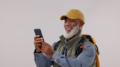 Phone,-problem-and-senior-man-hiking-in-studio
