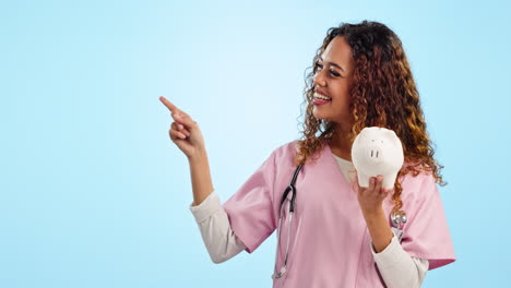 Doctor,-woman-and-happy-with-piggy-bank-in-studio