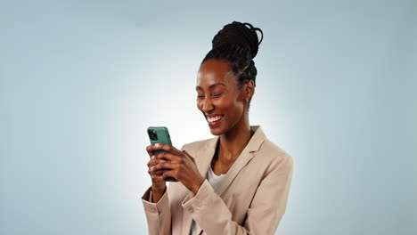 Phone,-smile-and-black-woman-in-a-studio-typing