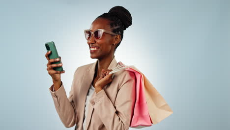 Happy-black-woman,-phone-and-shopping-bag