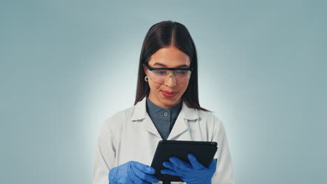 Scientist-woman,-tablet-and-thumbs-up-in-studio