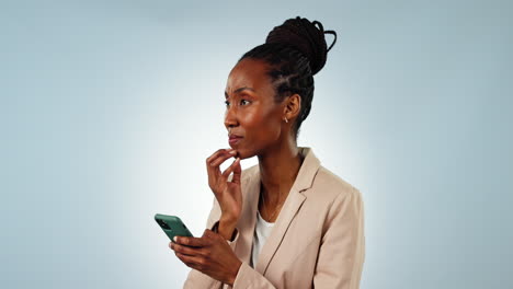 Thinking,-phone-and-black-woman-in-a-studio