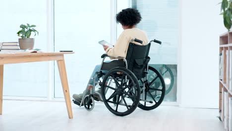 Woman,-wheelchair-and-tablet-in-office