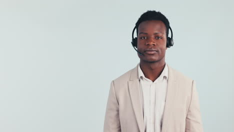 Black-man,-headset-and-call-centre