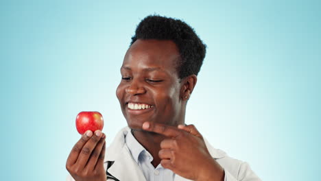 Studio,-pointing-and-face-of-doctor-with-apple