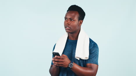 Black-man,-thinking-and-typing-with-phone