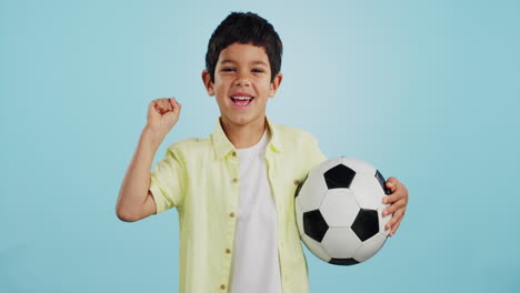 Winner,-soccer-ball-or-face-of-child-in-studio