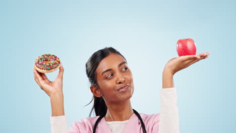 Woman-nurse-with-apple-and-donut-for-option