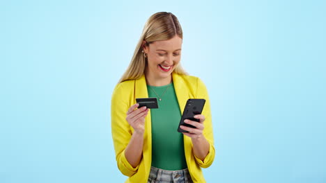 Phone,-credit-card-and-happy-woman-in-studio