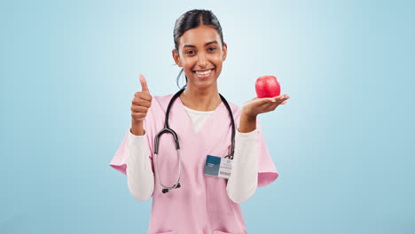 Thumbs-up,-apple-and-face-of-woman-nurse