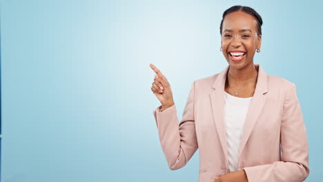 Black-woman-in-business,-pointing-at-mockup