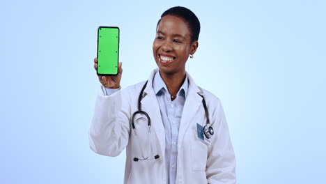 Phone,-green-screen-and-woman-doctor-with-thumbs