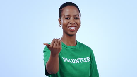 Volunteer,-woman-and-pointing-you-in-studio