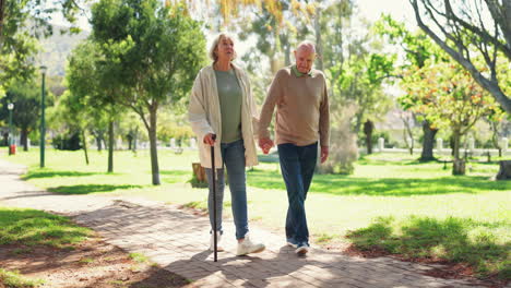 Mature-couple,-retired-and-walking-in-park
