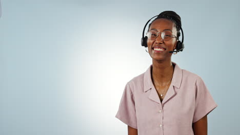 Call-center,-studio-and-happy-black-woman-point