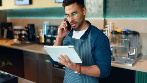 Man,-phone-call-and-tablet-for-cafe-communication