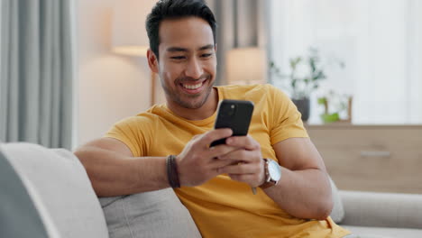 Home-smartphone,-smile-and-relax-man-typing