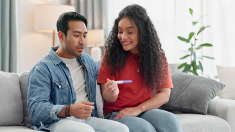 Love,-surprise-and-pregnancy-test-with-a-couple