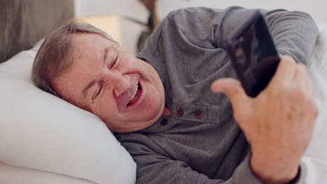 Senior-man,-bedroom-and-happy-with-phone