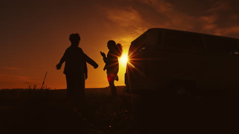 Group-hug,-silhouette-and-friends-travel-with-van