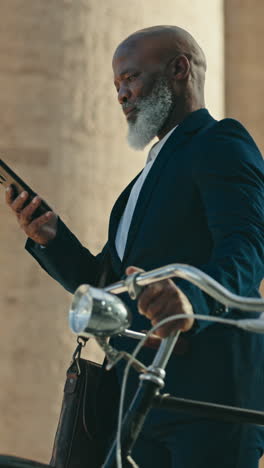 Phone,-bike-and-black-man-in-city-for-business