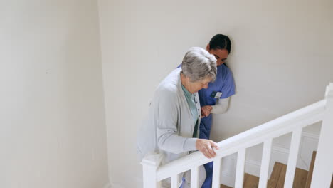 Senior,-woman-and-nurse-with-support-on-stairs