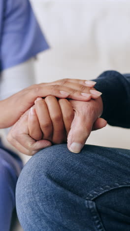 Nurse,-holding-hands-and-support-patient-in-home