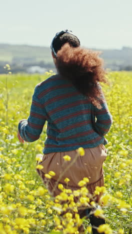 Woman-running,-flower-and-field-on-adventure