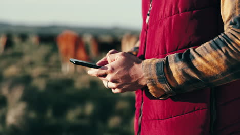 Hands,-agriculture-and-man-with-a-smartphone