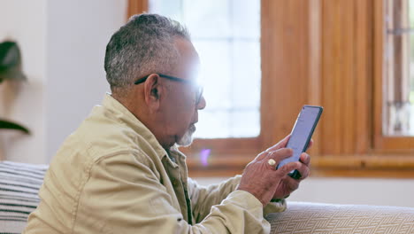 Senior-man,-phone-text-and-profile-at-home