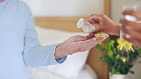 Hands,-caregiver-or-senior-patient-with-pills