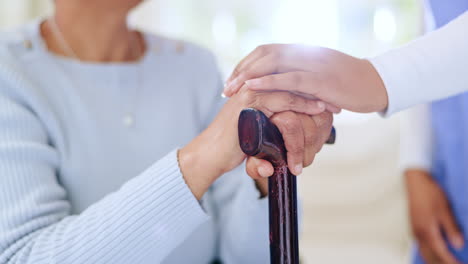 Nurse,-holding-hands-and-support-woman-with-cane
