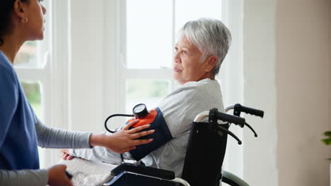 Blood-pressure,-caregiver-and-senior-woman