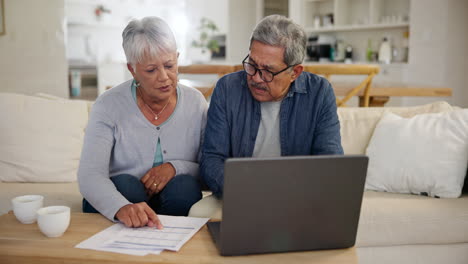 Couple,-worried-and-financial-planning-with-laptop