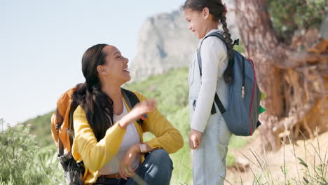 Hiking,-high-five-and-mother-with-girl-child