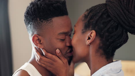 Kiss,-love-and-African-couple-in-bedroom-together