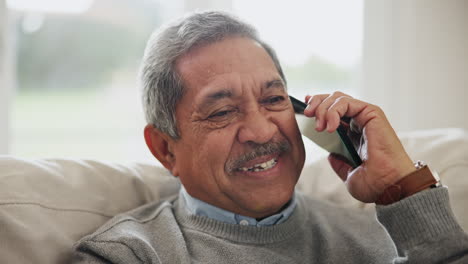 Senior-man,-smile-and-phone-call-in-home