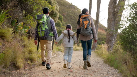 Happy-family,-hiking-and-holding-hands-outdoor