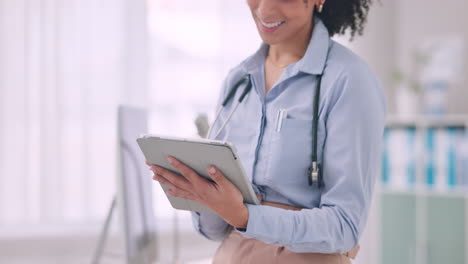 Tablet,-closeup-and-woman-doctor-doing-research
