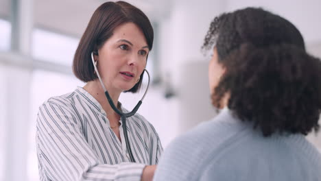 Consultation,-doctor-and-women-with-stethoscope