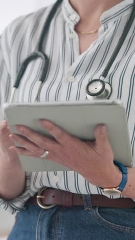 Tablet,-hands-typing-and-doctor-research