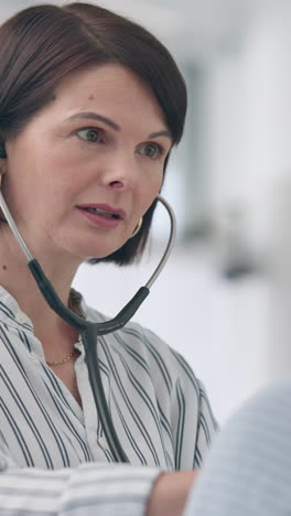 Doctor,-woman-and-stethoscope-for-listening
