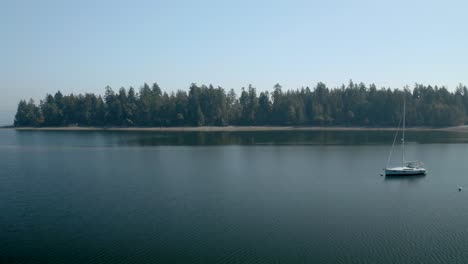 Gorgeous-View-Of-Penrose-State-Park-Washington-Composed-Of-Green-Trees-and-Calm-Water---Wide-Shot