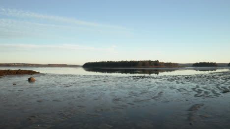 Low-Fly-over-drone-footage-over-MDI-mudflats-in-Maine,-USA