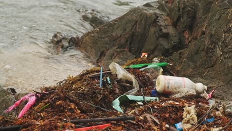 Close-up-shot-of-plastic,garbage,trash-and-waste-on-beach-shore-in-Asia