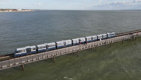 Pier-train-traveling-along-Southend-on-Sea-Aerial-footage