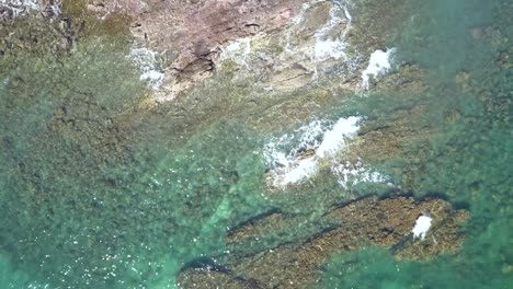 Rock-Formations-in-Clear-Turquoise-Water-on-Baja-Coast-in-Mexico---Aerial-Overhead-Drone-view