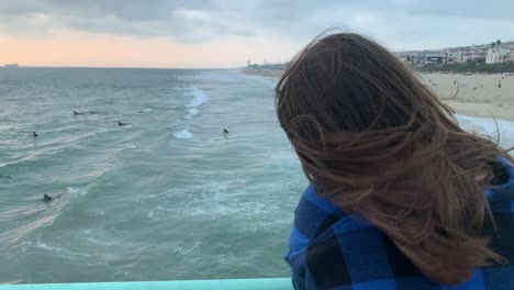 girl-looking-out-into-ocean